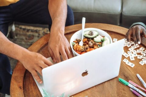 person holding white ceramic bowl with food